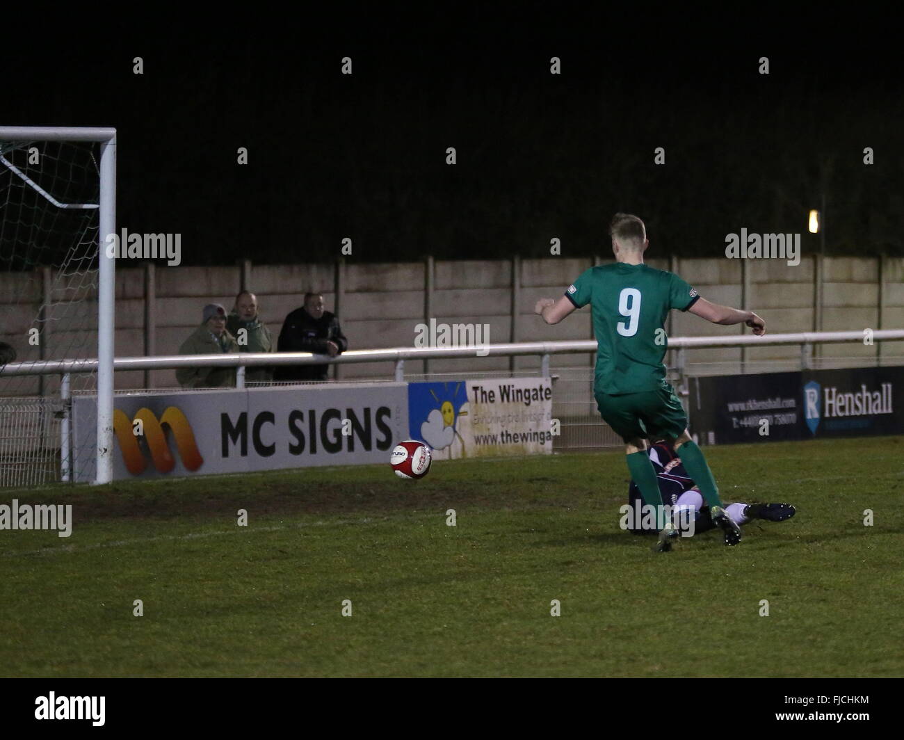 Nantwich, Cheshire, UK. 1st March, 2016. Sam Cosgrove of Nantwich Town rounds Bamber Bridge 'keeper Lee Dovey to open the scoring for Nantwich Town during the Integro Doodson Sports Cup match between Nantwich Town and Bamber Bridge at the Weaver Stadium. Credit:  Simon Newbury/Alamy Live News Stock Photo