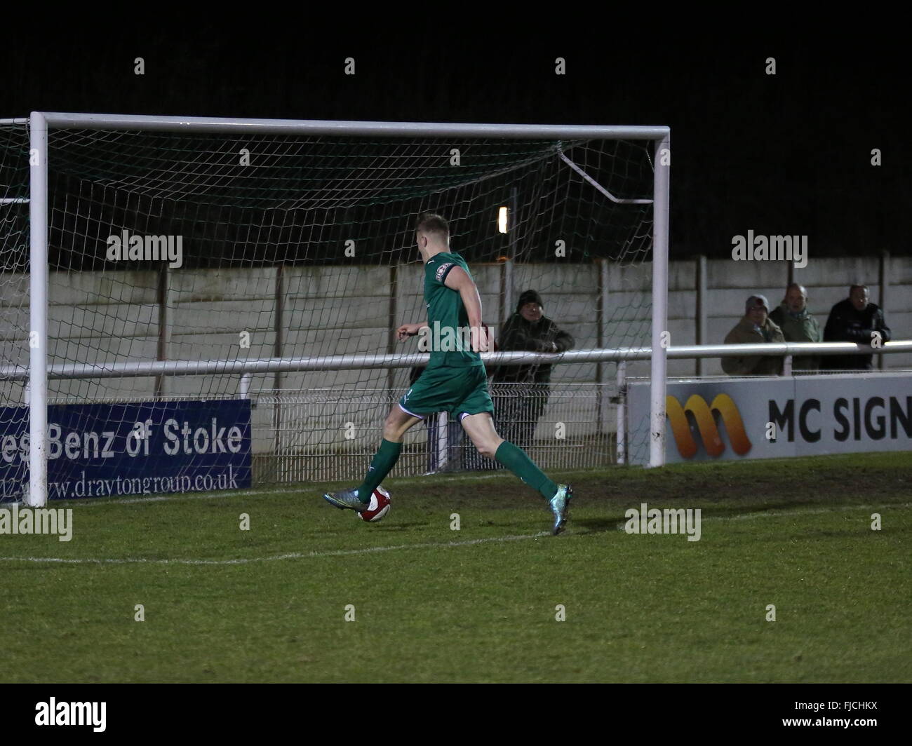 Nantwich, Cheshire, UK. 1st March, 2016. Sam Cosgrove of Nantwich Town rounds Bamber Bridge 'keeper Lee Dovey to open the scoring for Nantwich Town during the Integro Doodson Sports Cup match between Nantwich Town and Bamber Bridge at the Weaver Stadium. Credit:  Simon Newbury/Alamy Live News Stock Photo
