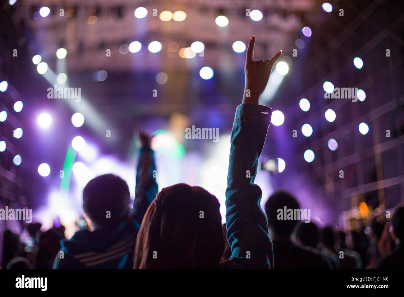 Happy young Chinese woman at music festival Stock Photo - Alamy