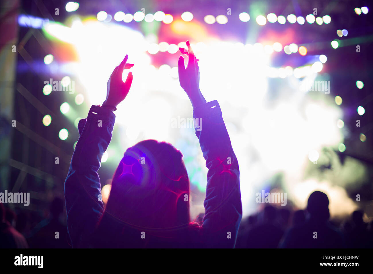 Happy young Chinese woman at music festival Stock Photo - Alamy