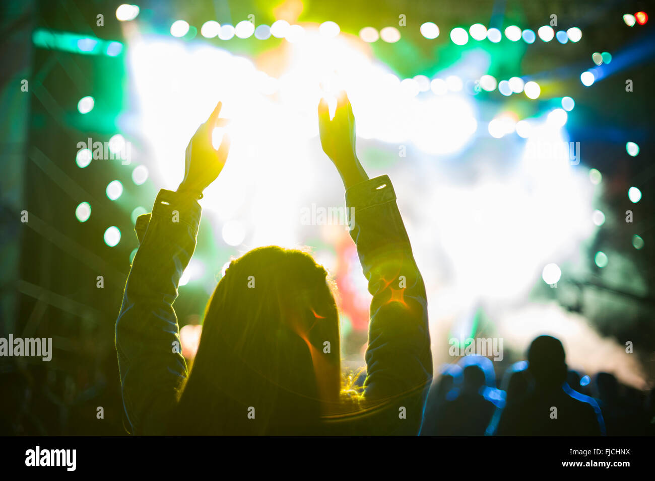 Happy young Chinese woman at music festival Stock Photo - Alamy