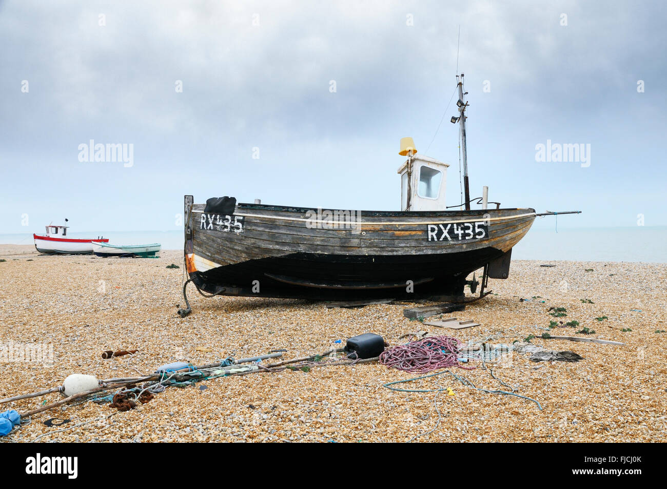 Fishing boats on Dungeness beach, Kent, England, UK Stock Photo