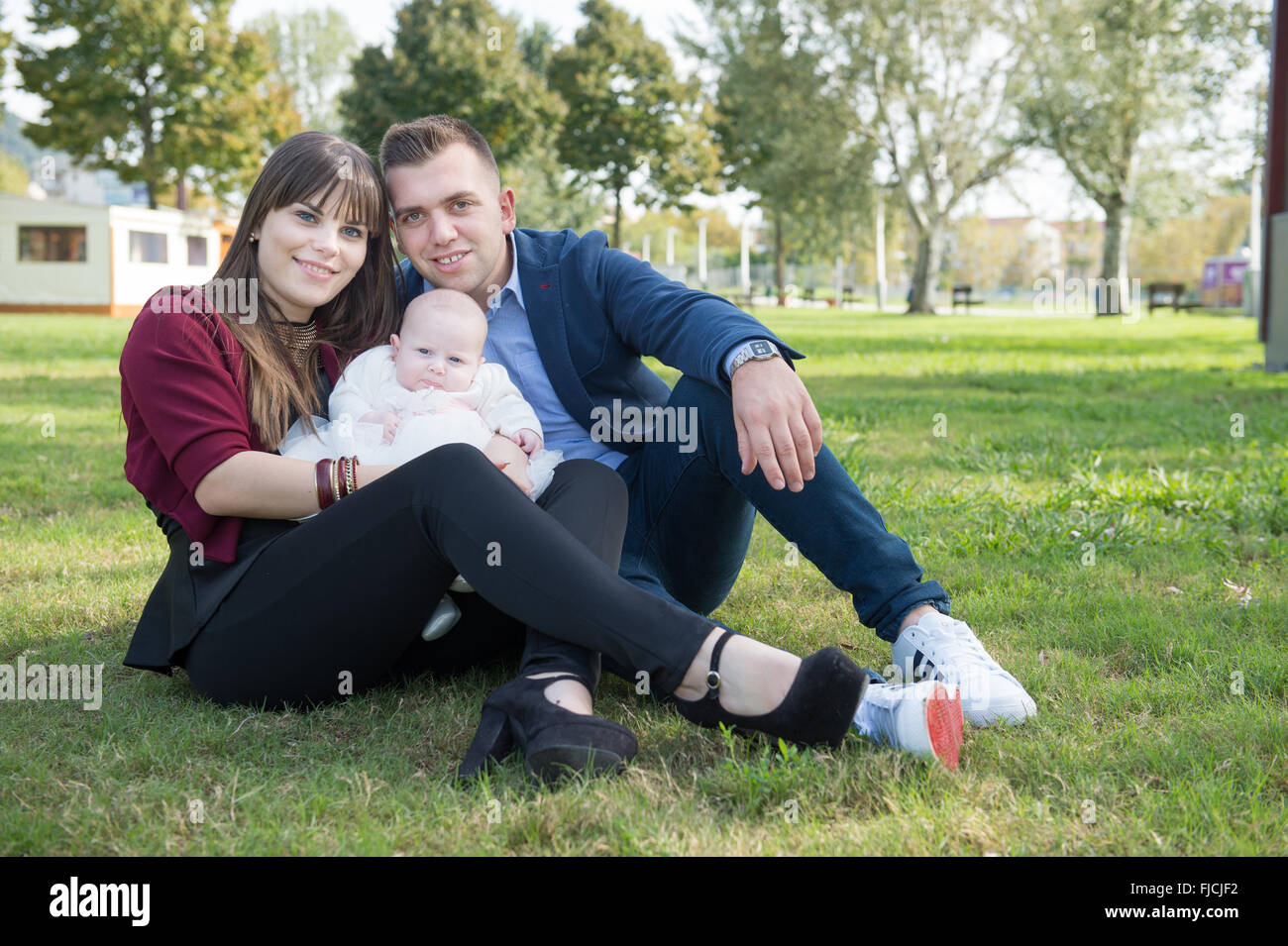 Young family with first baby in the park Stock Photo