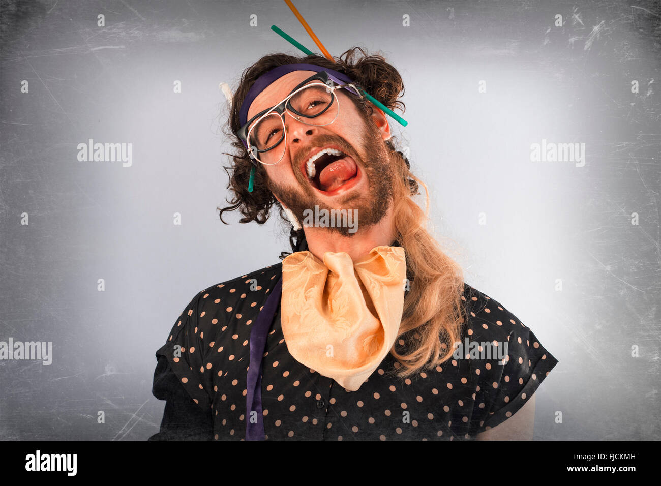 Bearded crazy person lunatic wearing several pairs of glasses Stock Photo