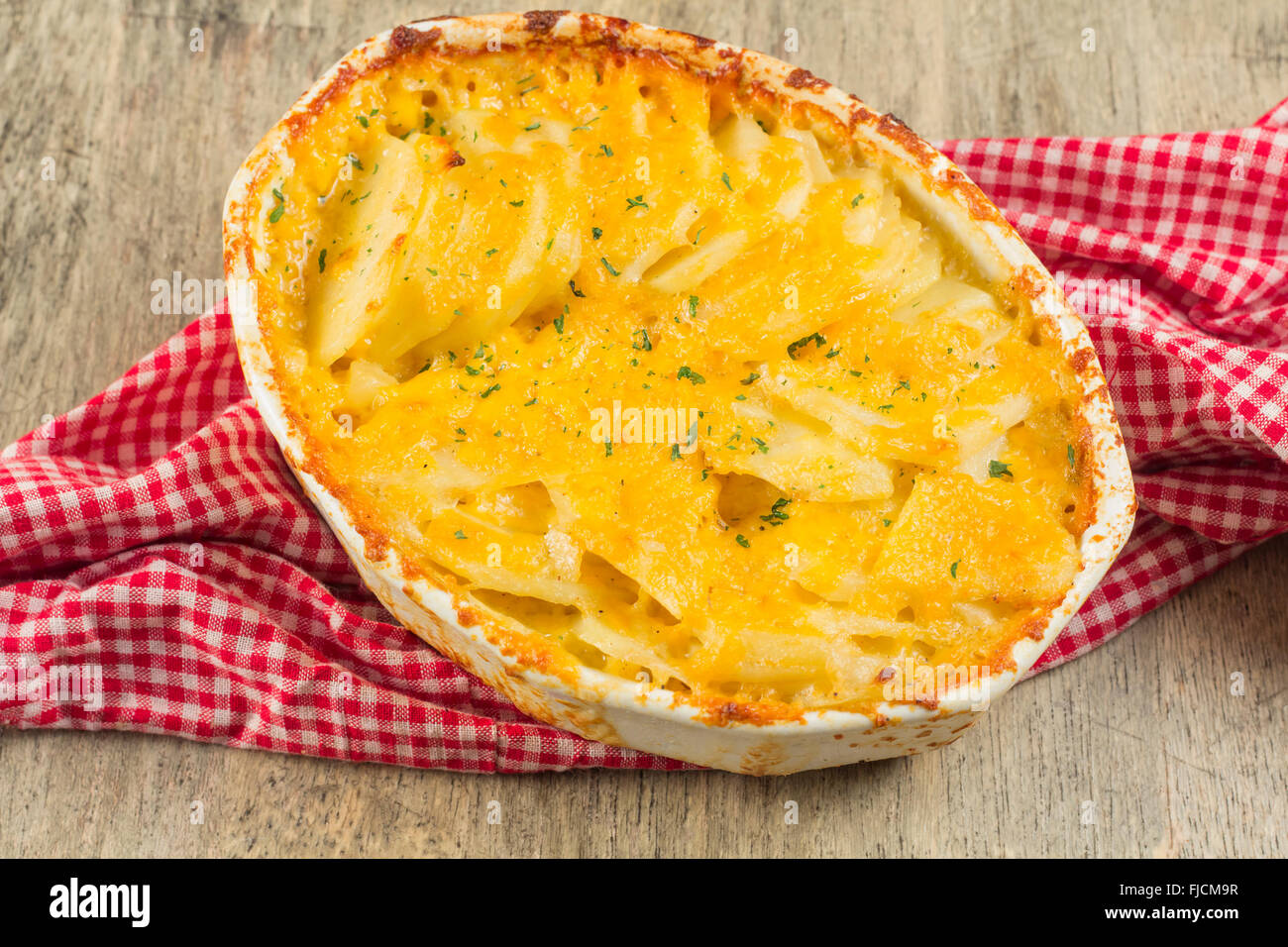 Baked cheesy potatoes au gratin scalloped potatoes Stock Photo Alamy