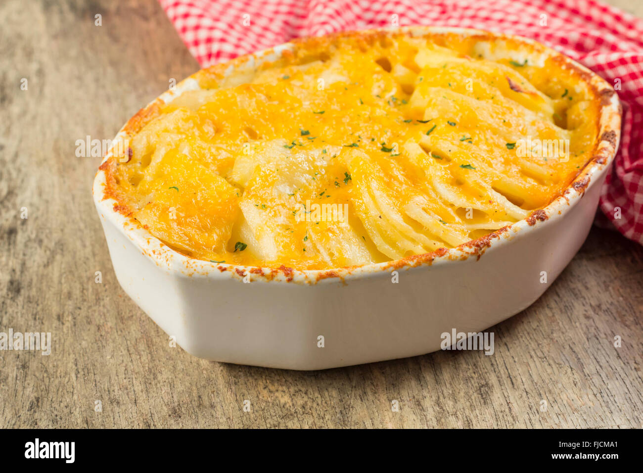 Baked cheesy potatoes au gratin scalloped potatoes Stock Photo Alamy