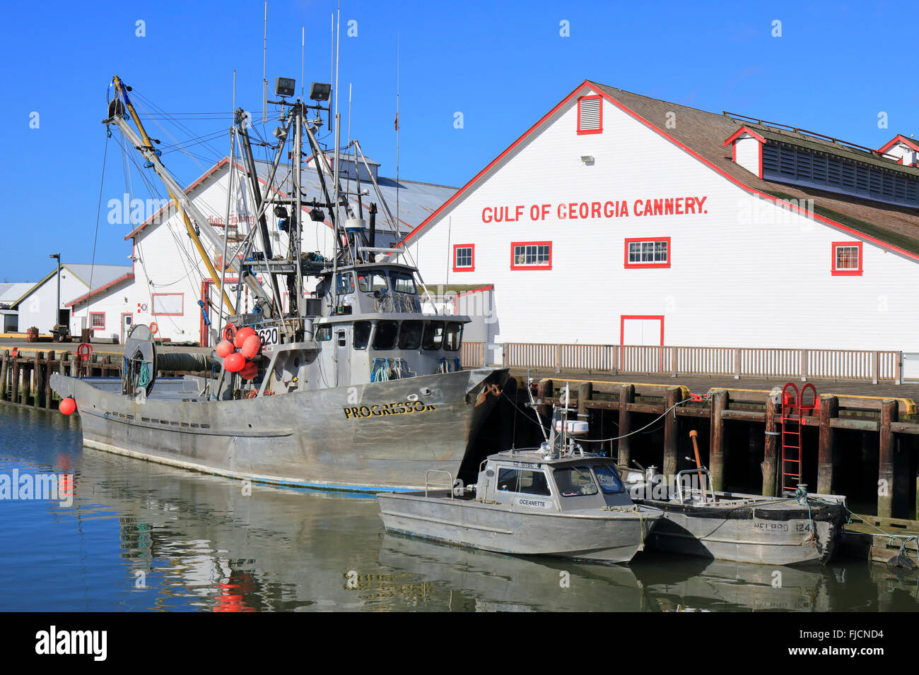 Fishing boats moored at Gulf of Georgia Cannery dock. Richmond, BC, Canada . Stock Photo