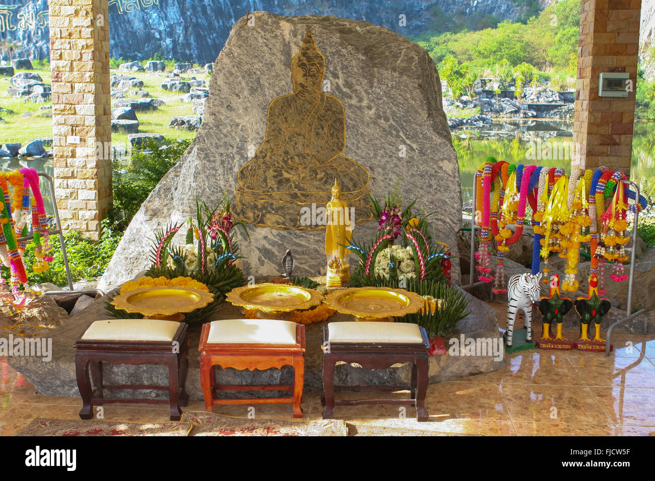 Buddhist Altar Near Golden Buddha Rock In Thailand Stock