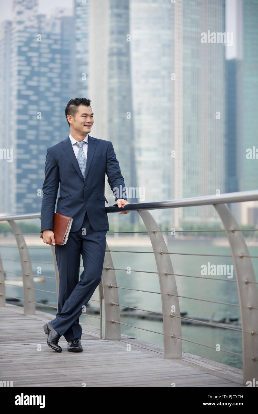 A happy looking Asian businessman Stock Photo - Alamy
