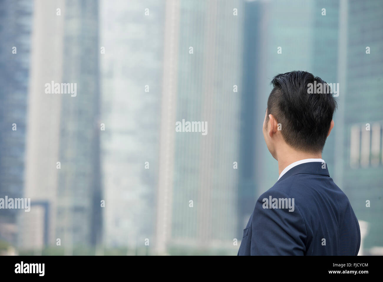 A happy looking Asian businessman Stock Photo - Alamy