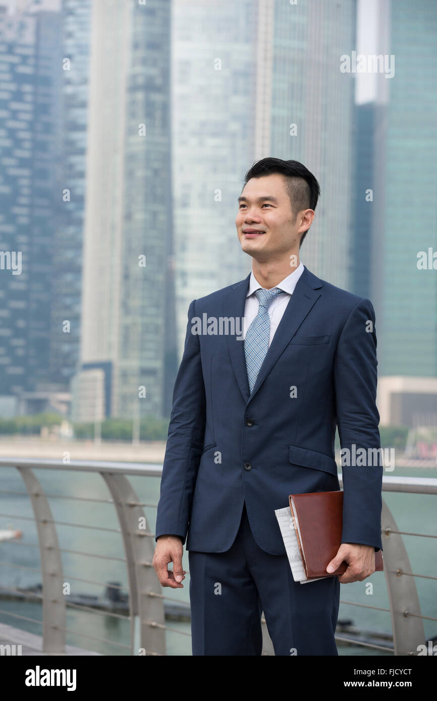 A happy looking Asian businessman Stock Photo - Alamy