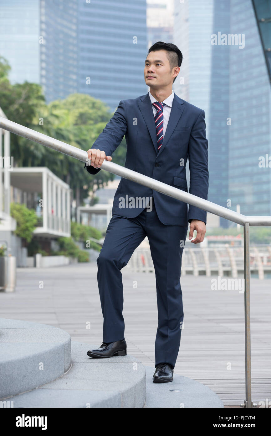 A happy looking Asian businessman Stock Photo - Alamy