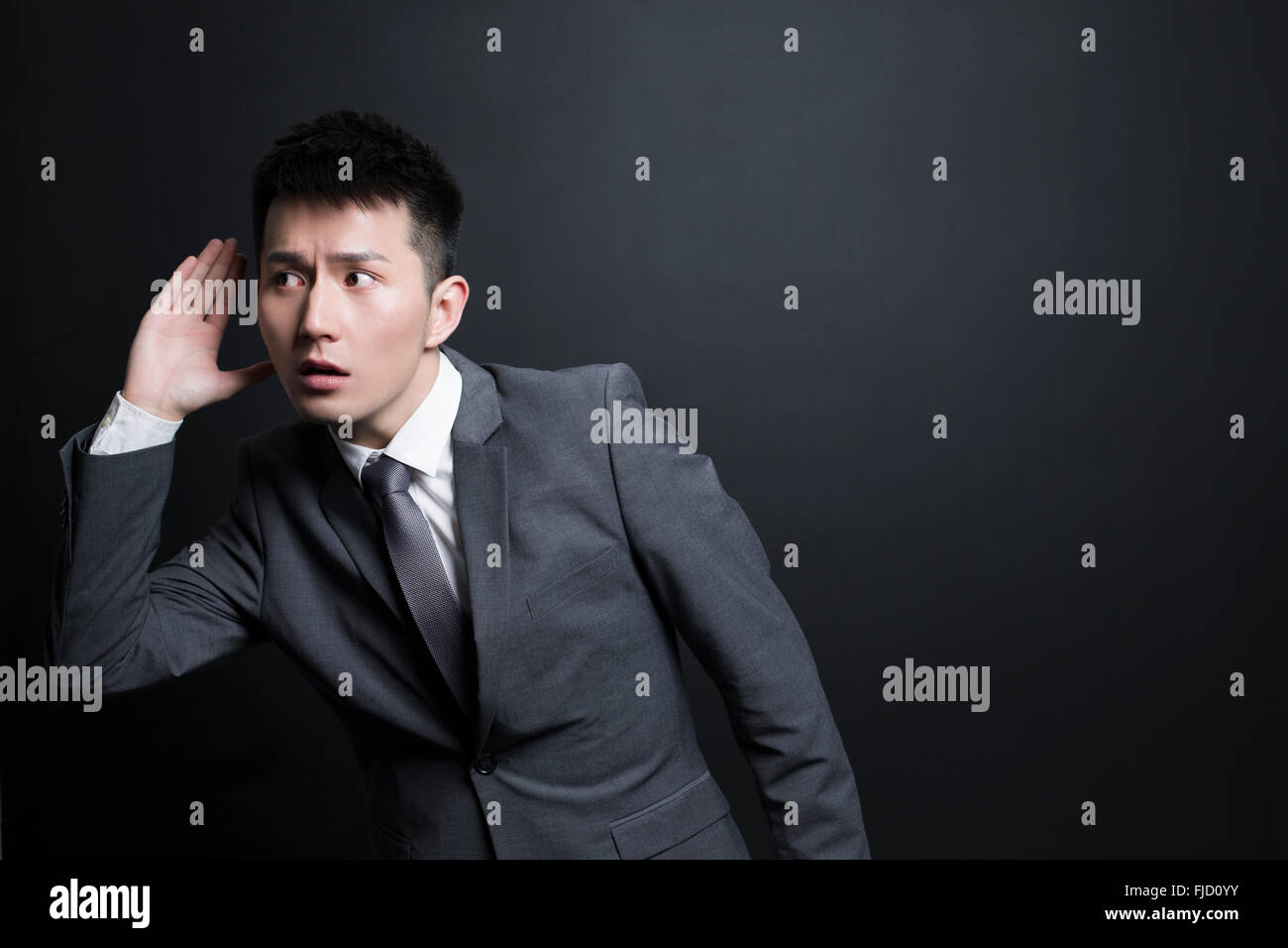 Chinese Businessman Eavesdropping Stock Photo Alamy