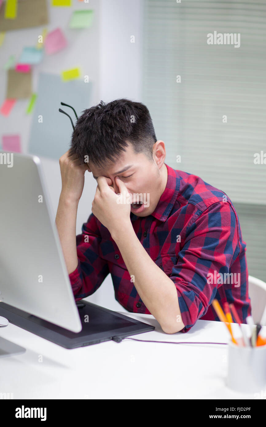 Tired Chinese Illustrator Stock Photo Alamy