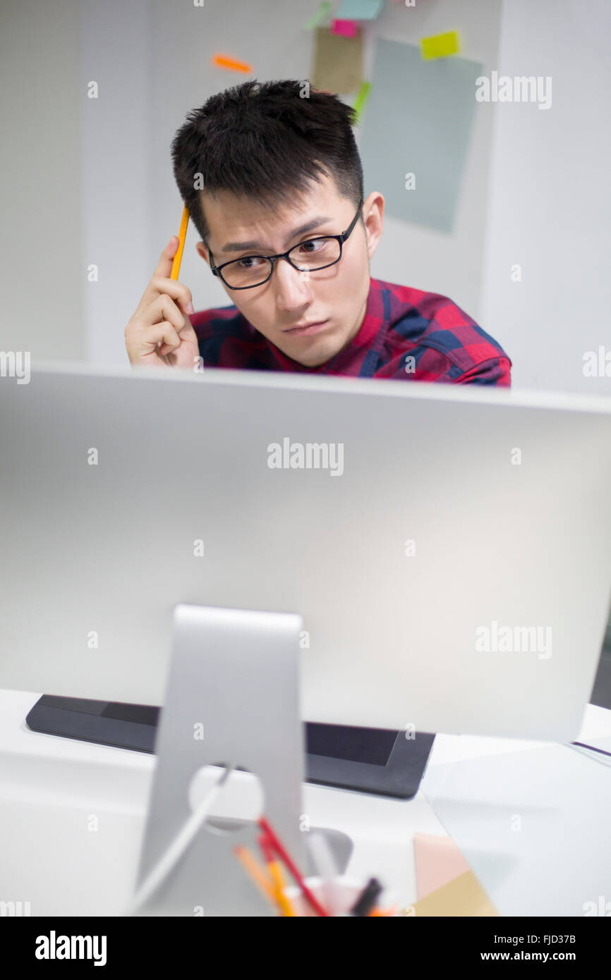 Chinese illustrator working in office Stock Photo Alamy