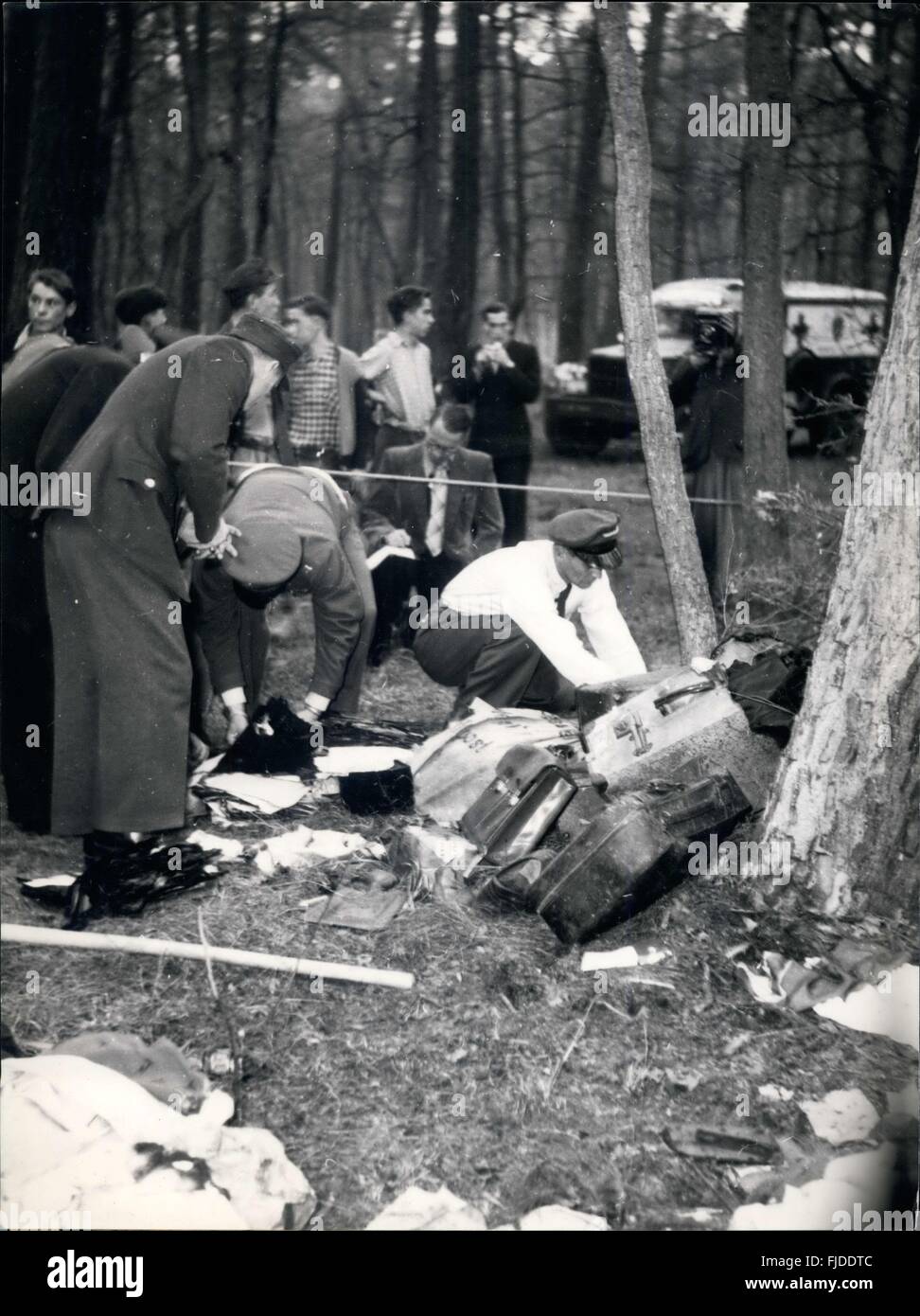 1952 - 44 Killed In Frankfort-Brussels Plane Crash: While taking off from Frankfort on Main airport for Brussels a Belgian Sabena airliner crashed and exploded killing 44 passengers and 4 crewmen. It was Germany's biggest civil aviation disaster after the war. Photo shows German police collect salvaged passengers baggage near the crashed plane. © Keystone Pictures USA/ZUMAPRESS.com/Alamy Live News Stock Photo