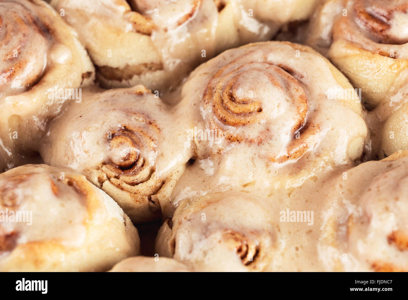 Delicious breakfast cinnamon rolls. Kanelbullar swedish pastry made at home. Shallow depth of field Stock Photo