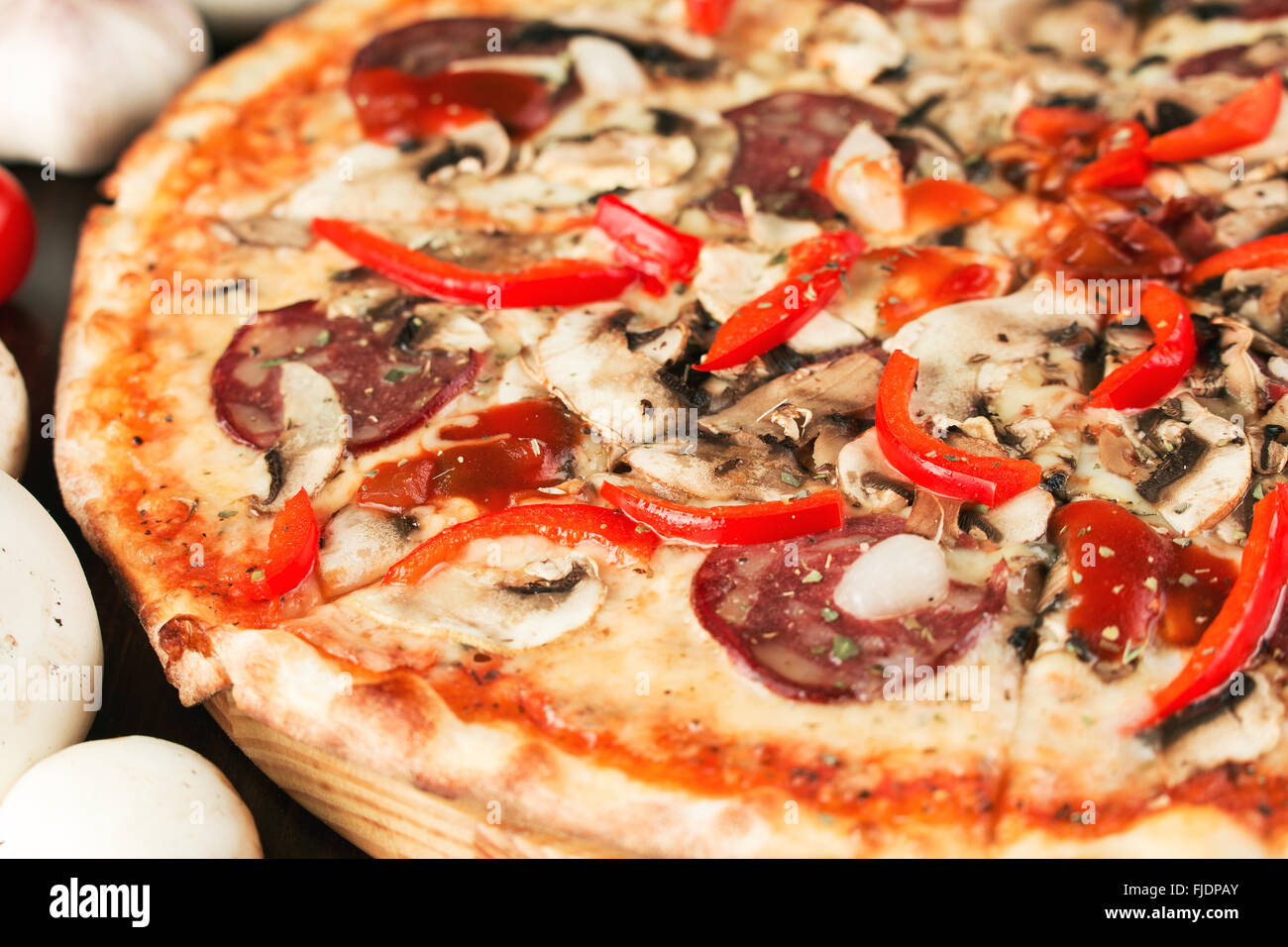 Pizza with bell pepper, onion and sausage close up. Shallow depth of