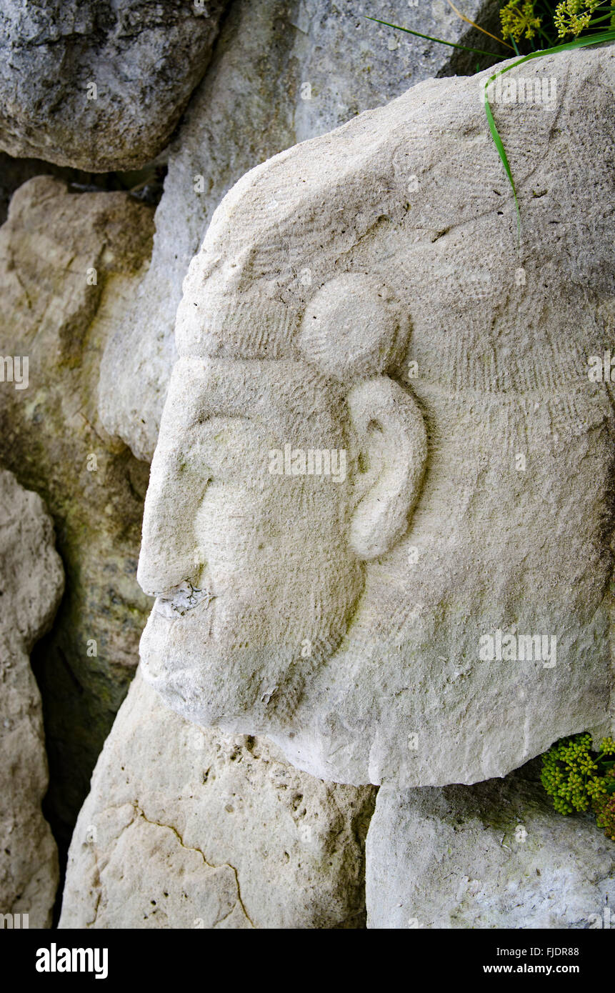 Carving of a face/head in Purbeck Stone Stock Photo