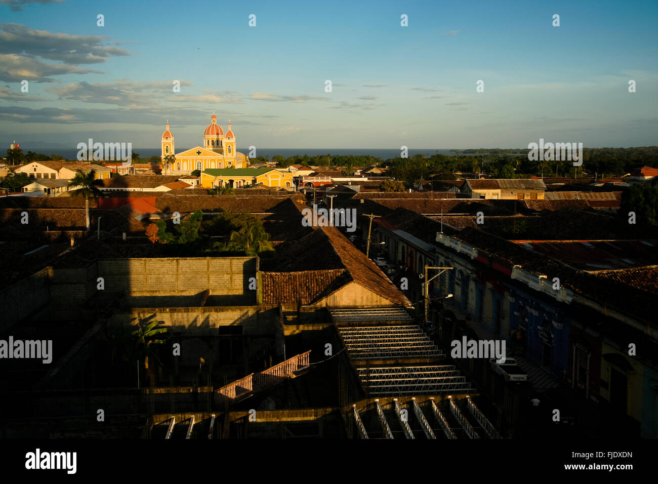 Granada, Nicaragua. View of Cathedral de Granada over Granada's rooftops at sunset. Stock Photo