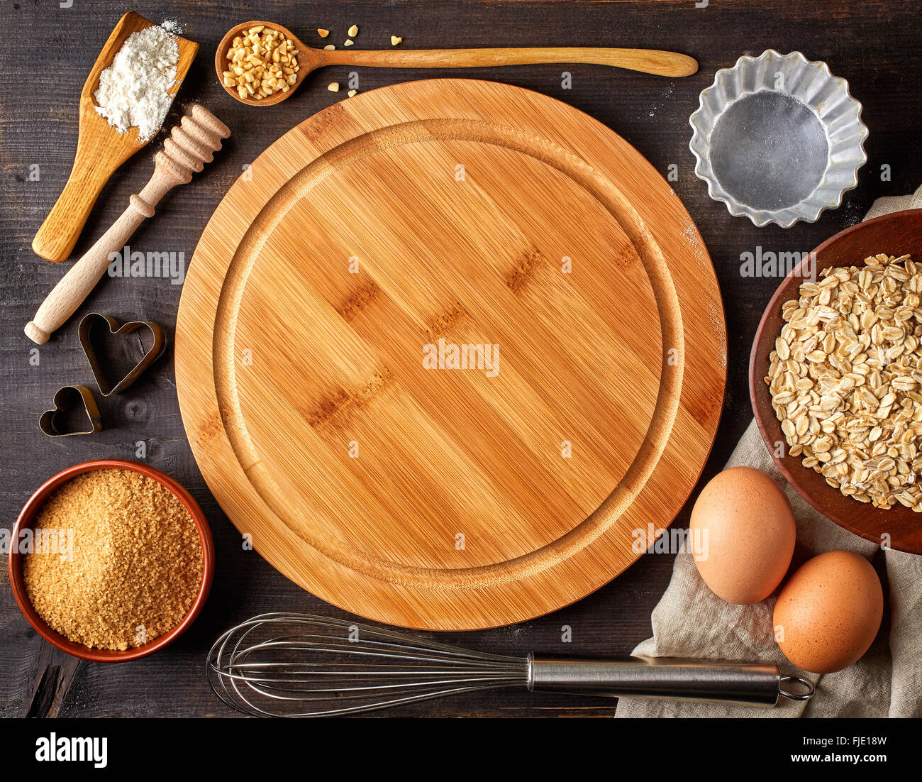 Baking background with cutting board, eggs, sugar, flour and various