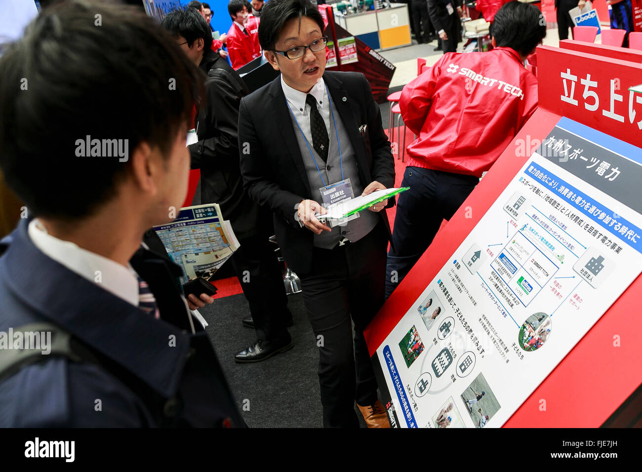 An exhibitor introduces Smart Tech energy services to a visitor during the 2nd Energy Market Liberalisation Expo in Tokyo Big Sight on March 2, 2016, Tokyo, Japan. Japan's electricity market will be opened up for the first time from April 2016 with new and existing suppliers allowed to compete for customers. It is hoped that deregulation will break up existing monopolies and drive down prices. The exhibition is part of World Smart Energy Week 2016 which organises various energy related shows and runs until March 4th. © Rodrigo Reyes Marin/AFLO/Alamy Live News Stock Photo
