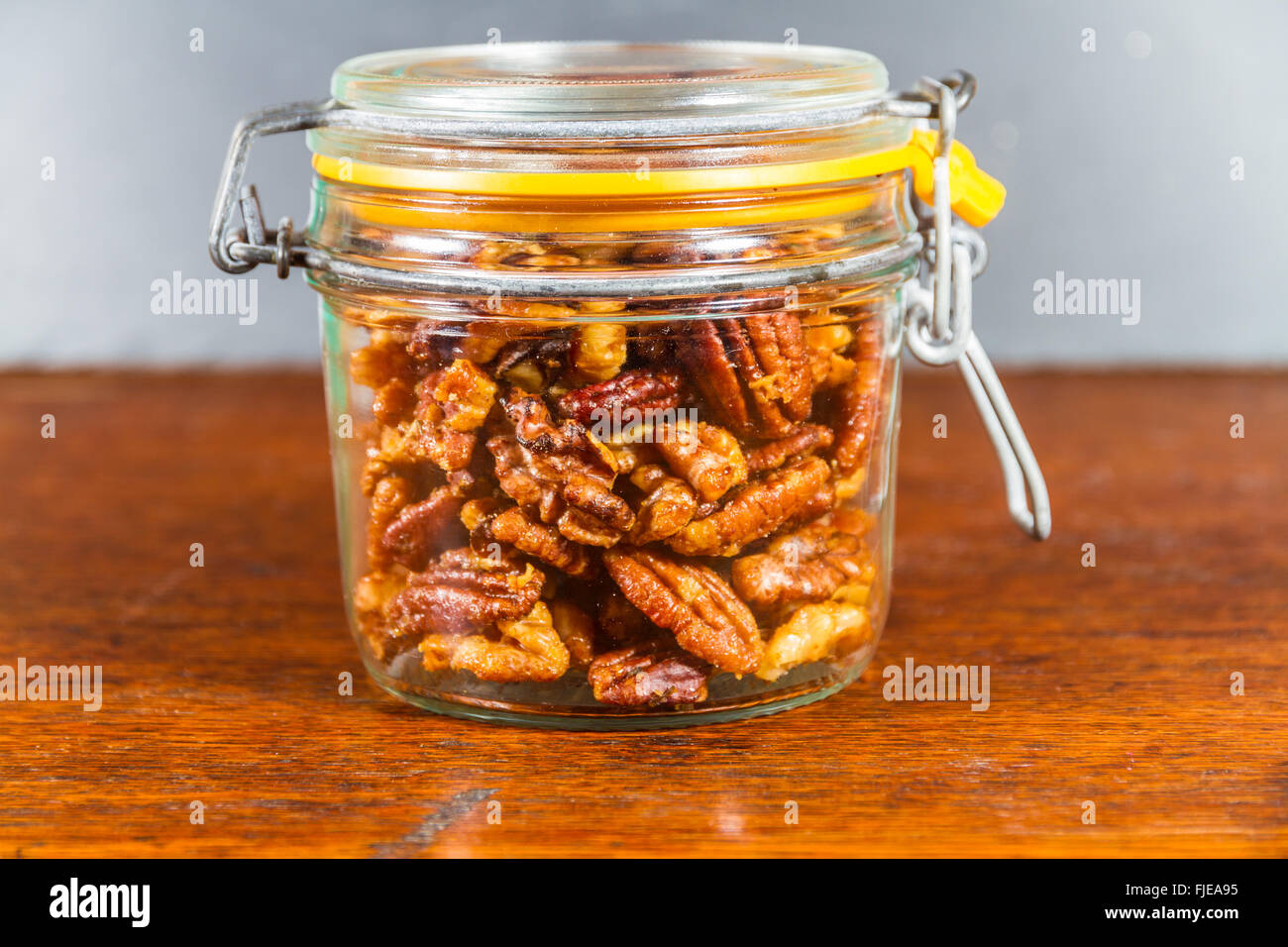 Pecan nuts and walnuts roasted with garlic and rosemary in jar. Dark background Stock Photo Alamy