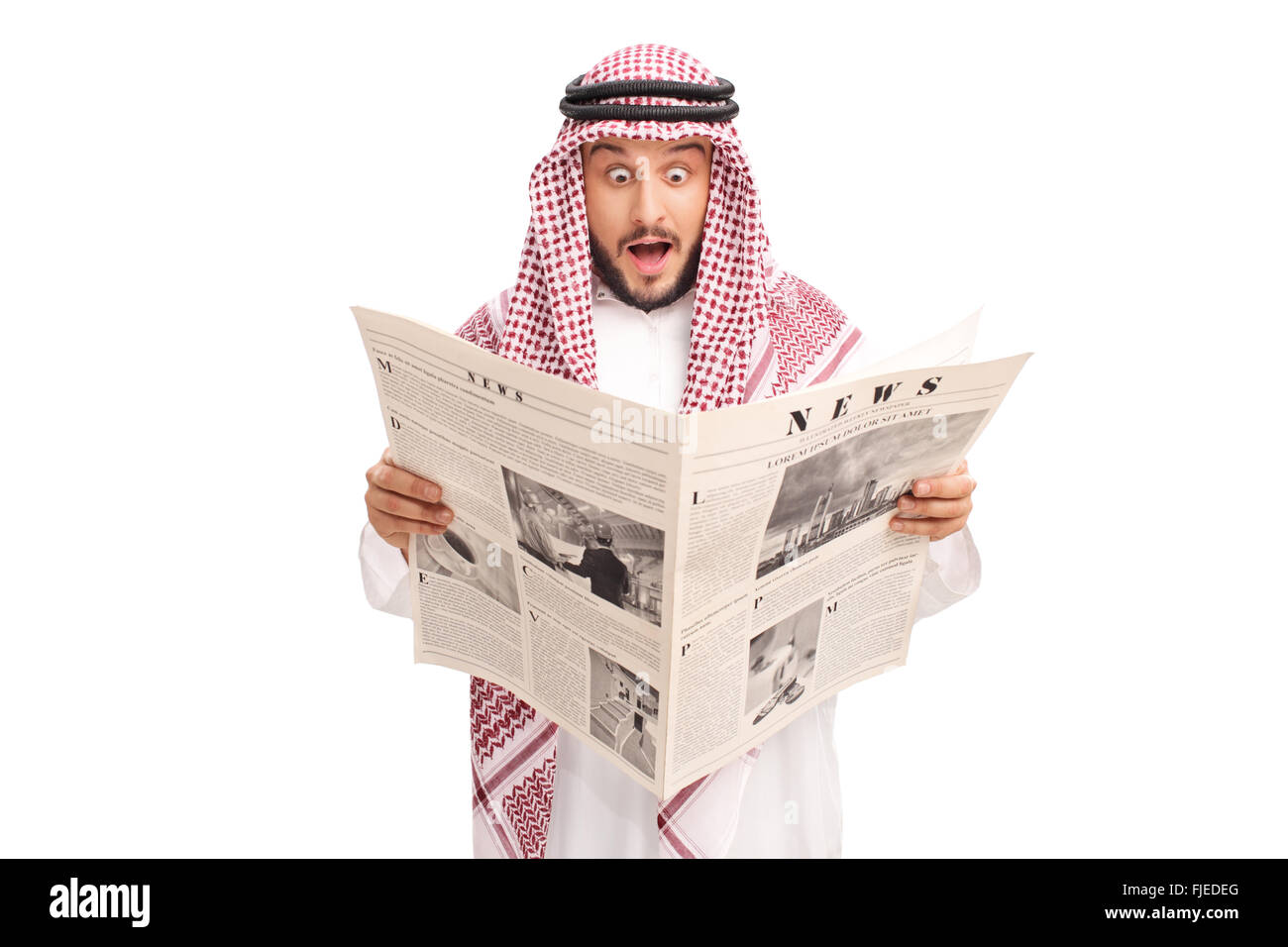 Surprised young Arab reading a newspaper and making a baffled