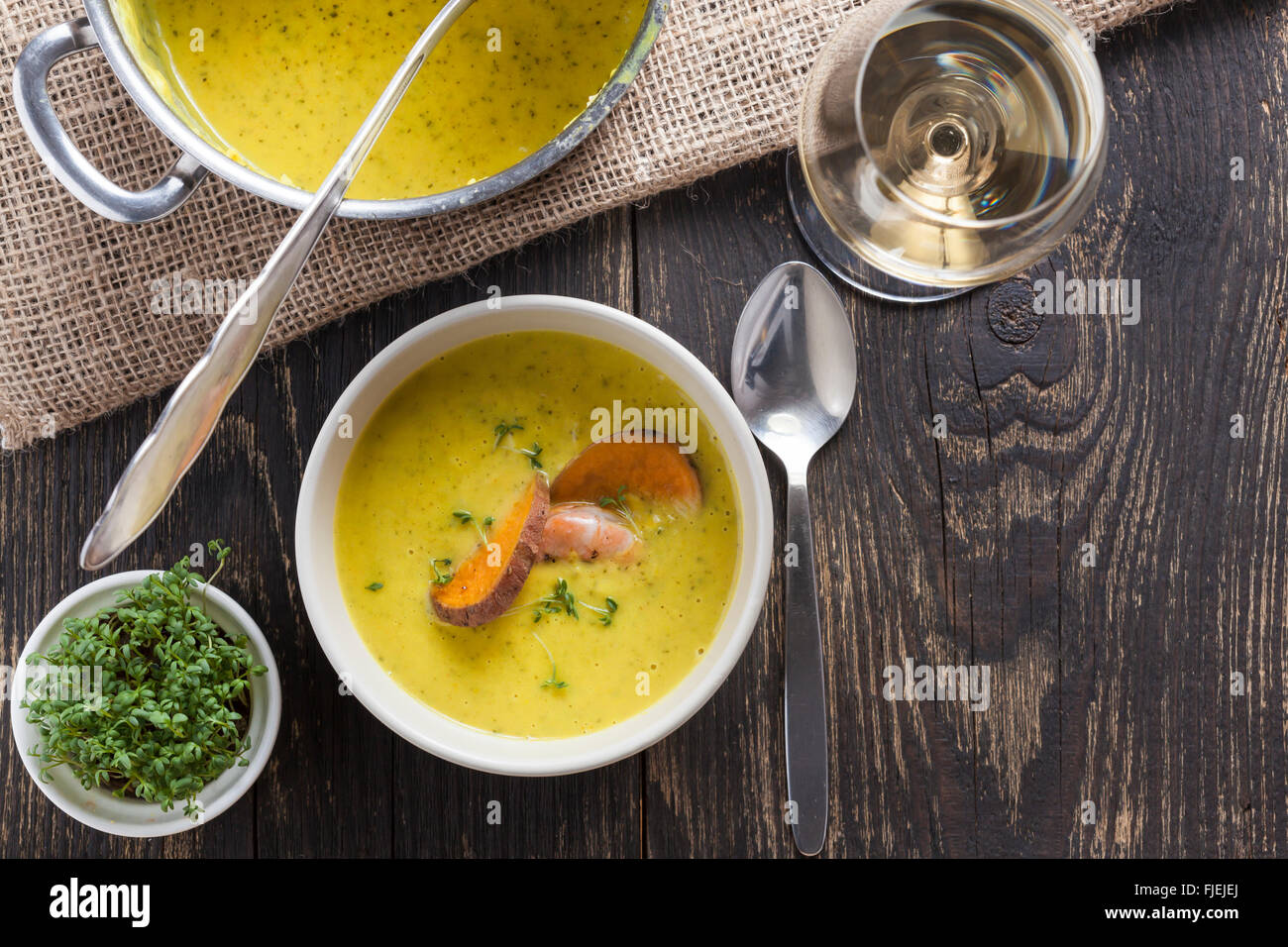 curry sweet potato soup with shrimp on vintage table Stock Photo