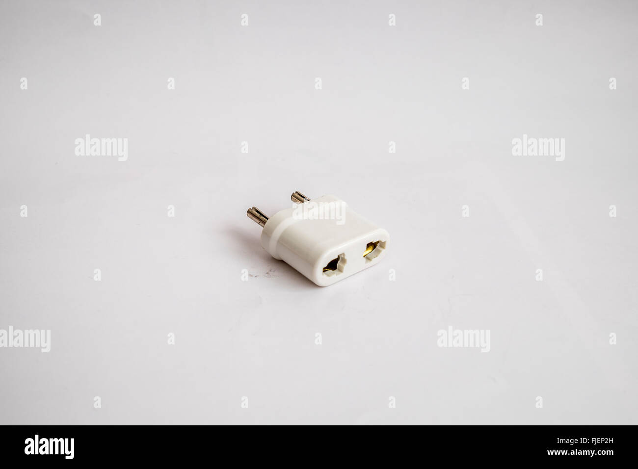 Two pin UK mains adapter for use with an electric shaver in Europe Stock Photo