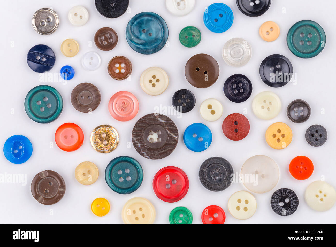 Colored buttons on white background Stock Photo - Alamy