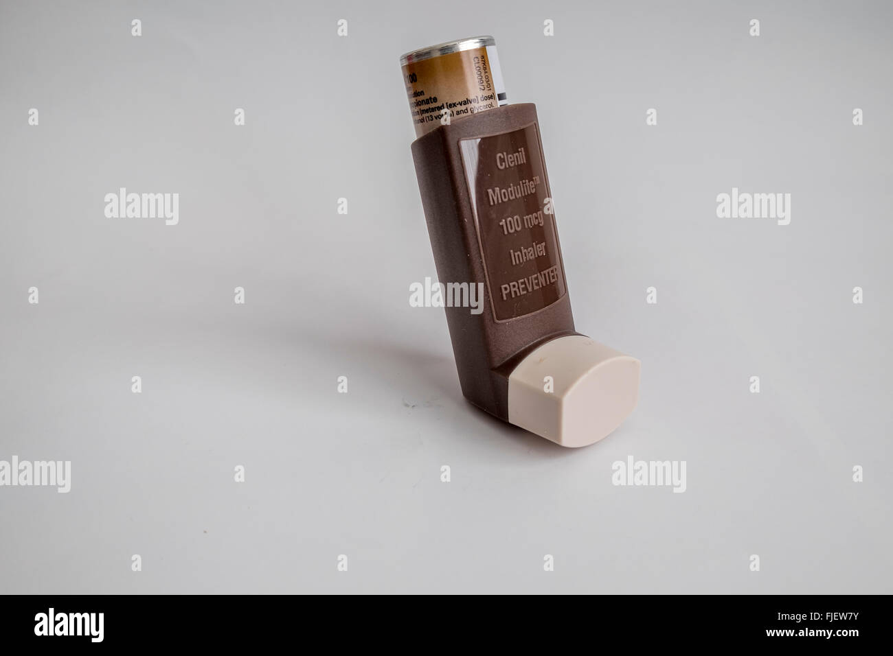 Preventer brown inhaler showing canister of liquid end cap and main body Stock Photo
