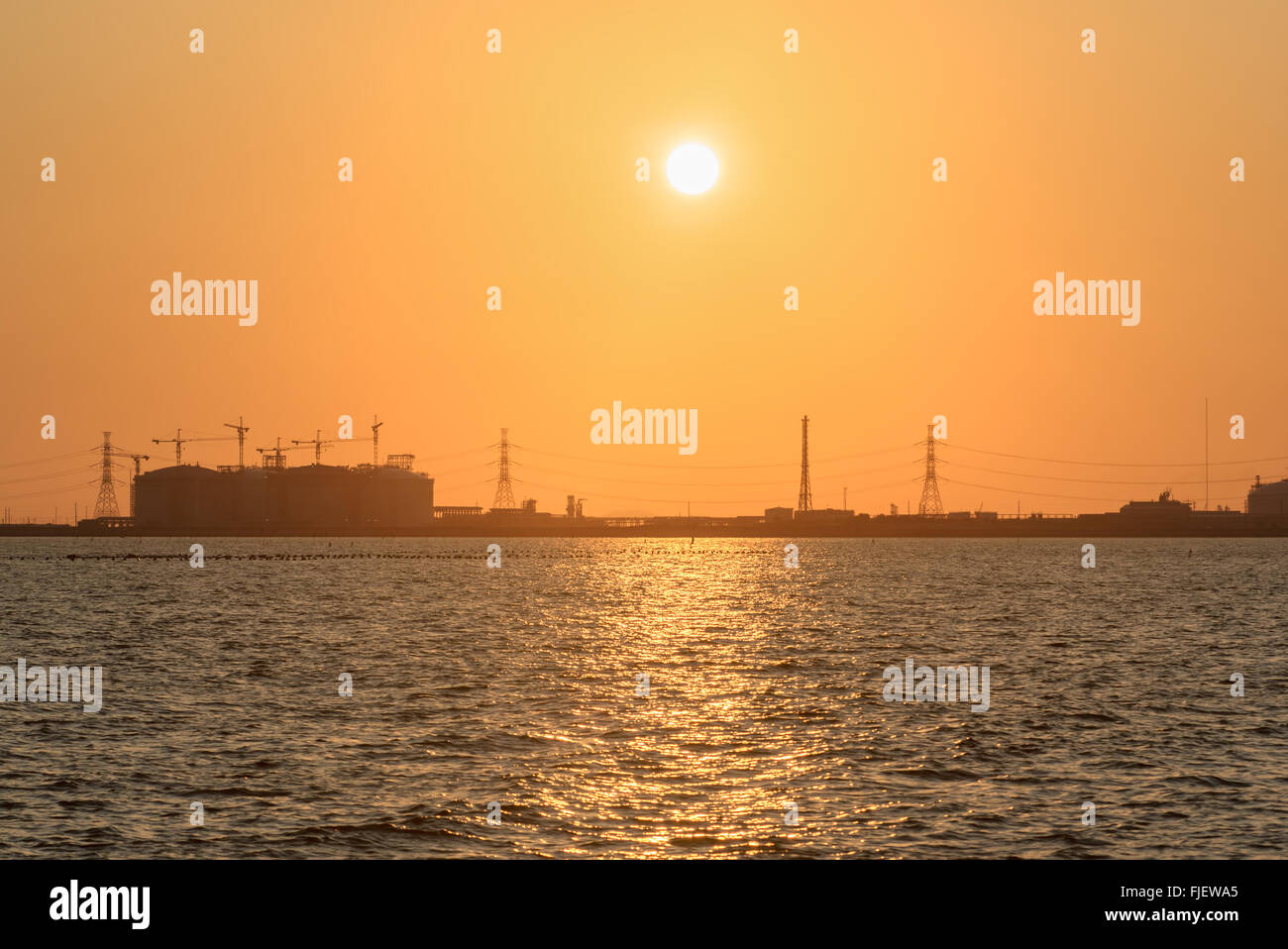 Oil refinery at sun light Stock Photo - Alamy