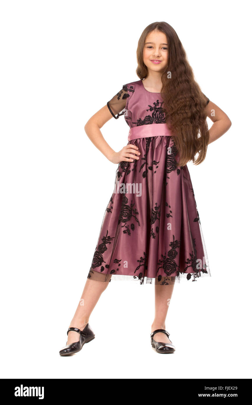 Long haired girl of six years in a summer dress isolated on white background. Stock Photo
