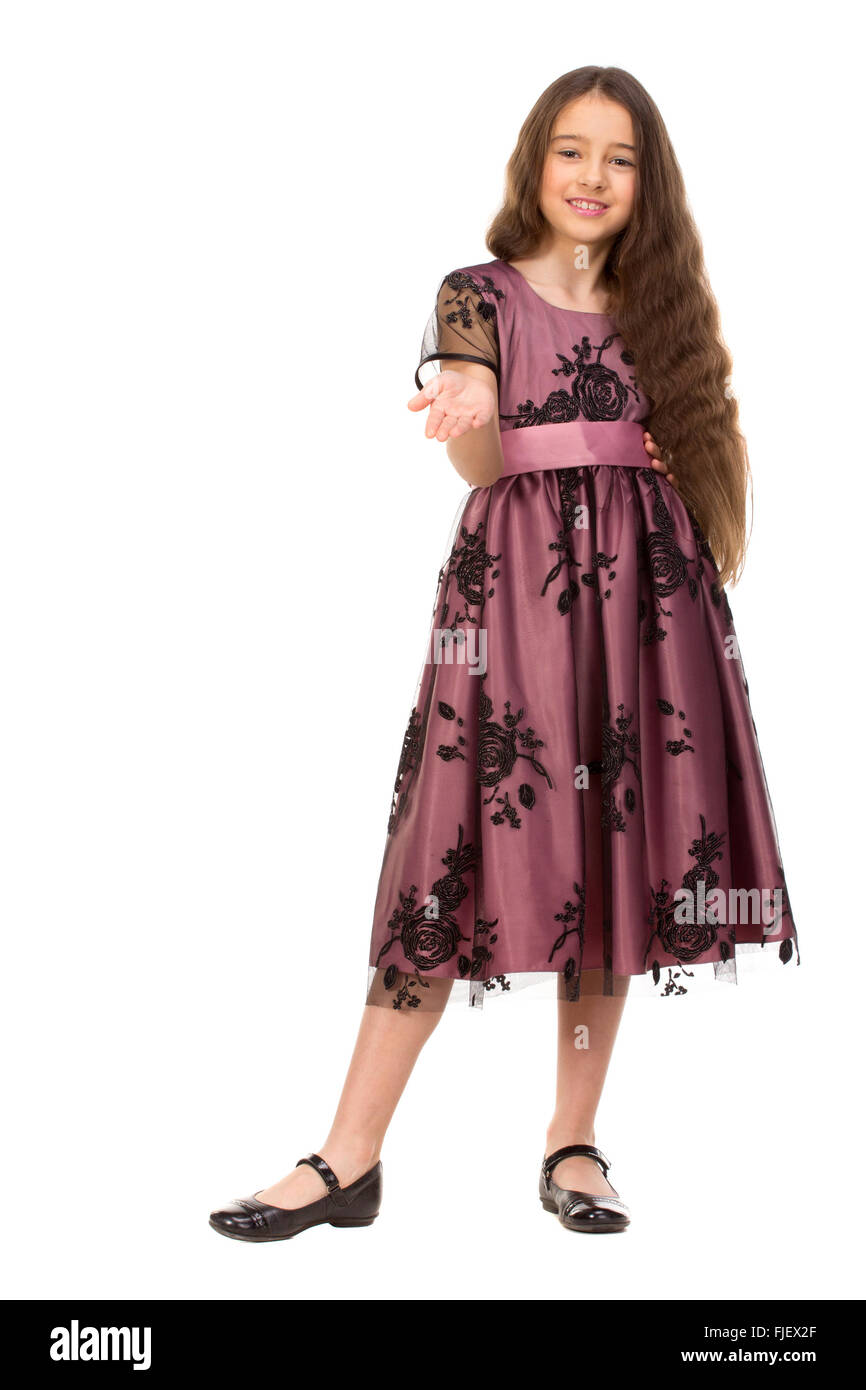 Long haired girl of six years in a summer dress isolated on white background. Stock Photo