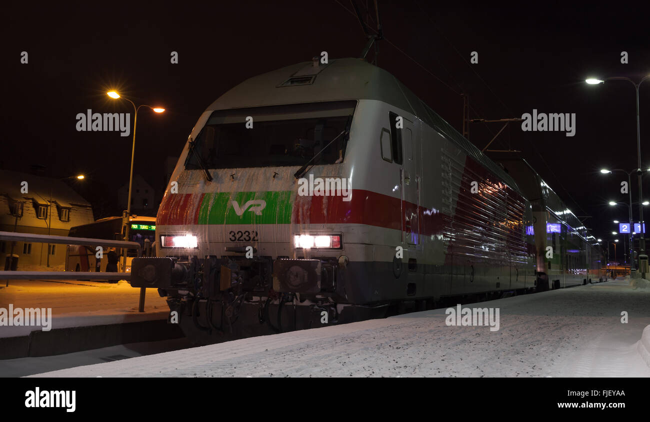 Turku, Finland - January 19, 2016: Modern passenger train on the railway station at night Stock Photo