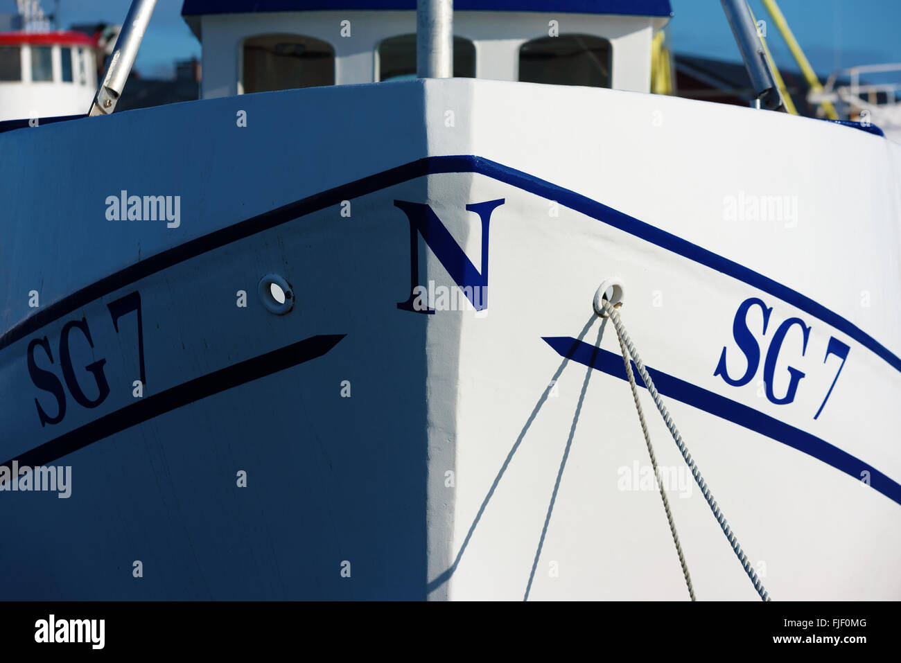 Nogersund, Sweden - February 27, 2016: Close up of the fore of a white fishing boat. The letter N is printed front most and iden Stock Photo