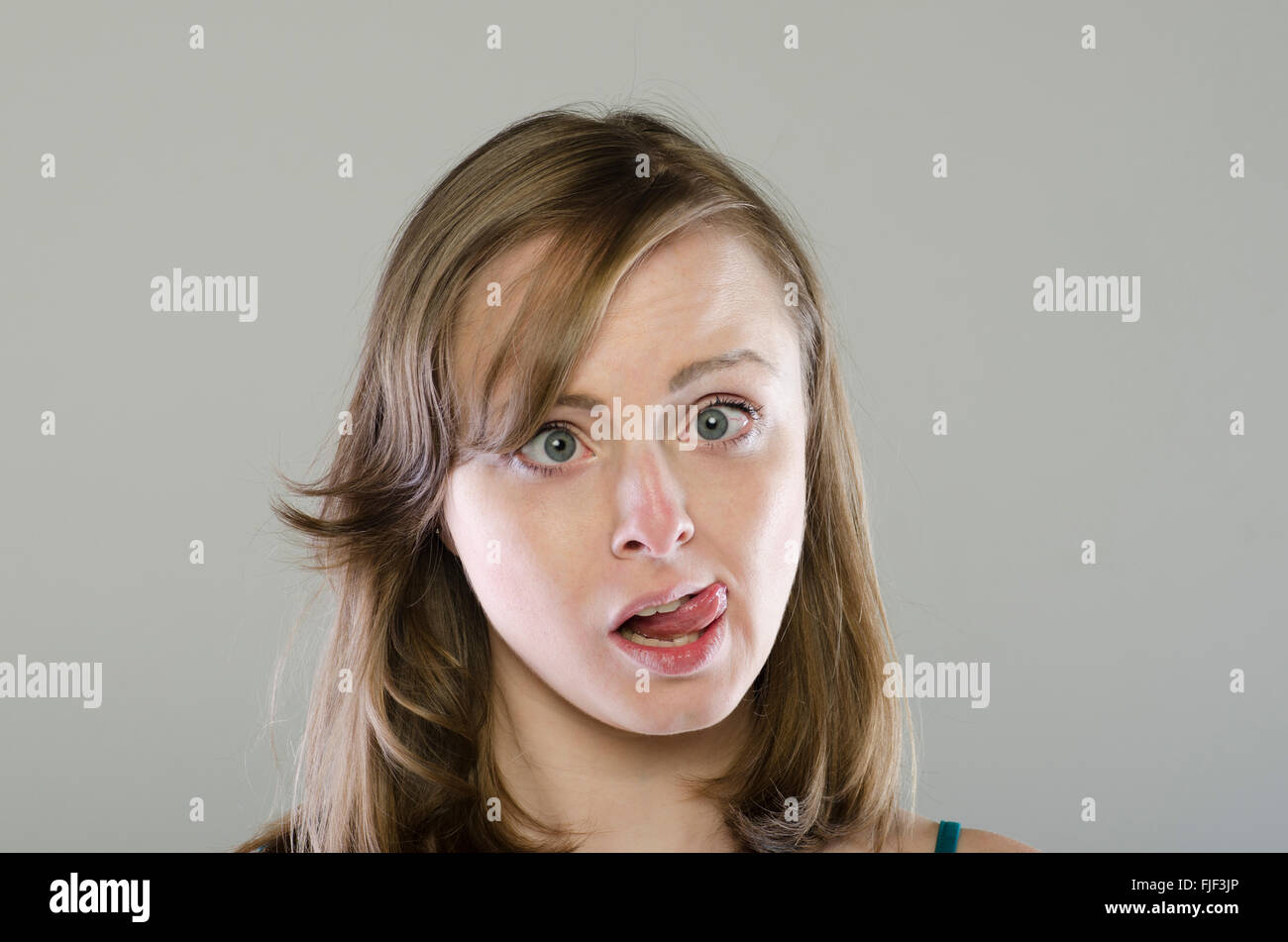 Young woman pulling a funny face Stock Photo