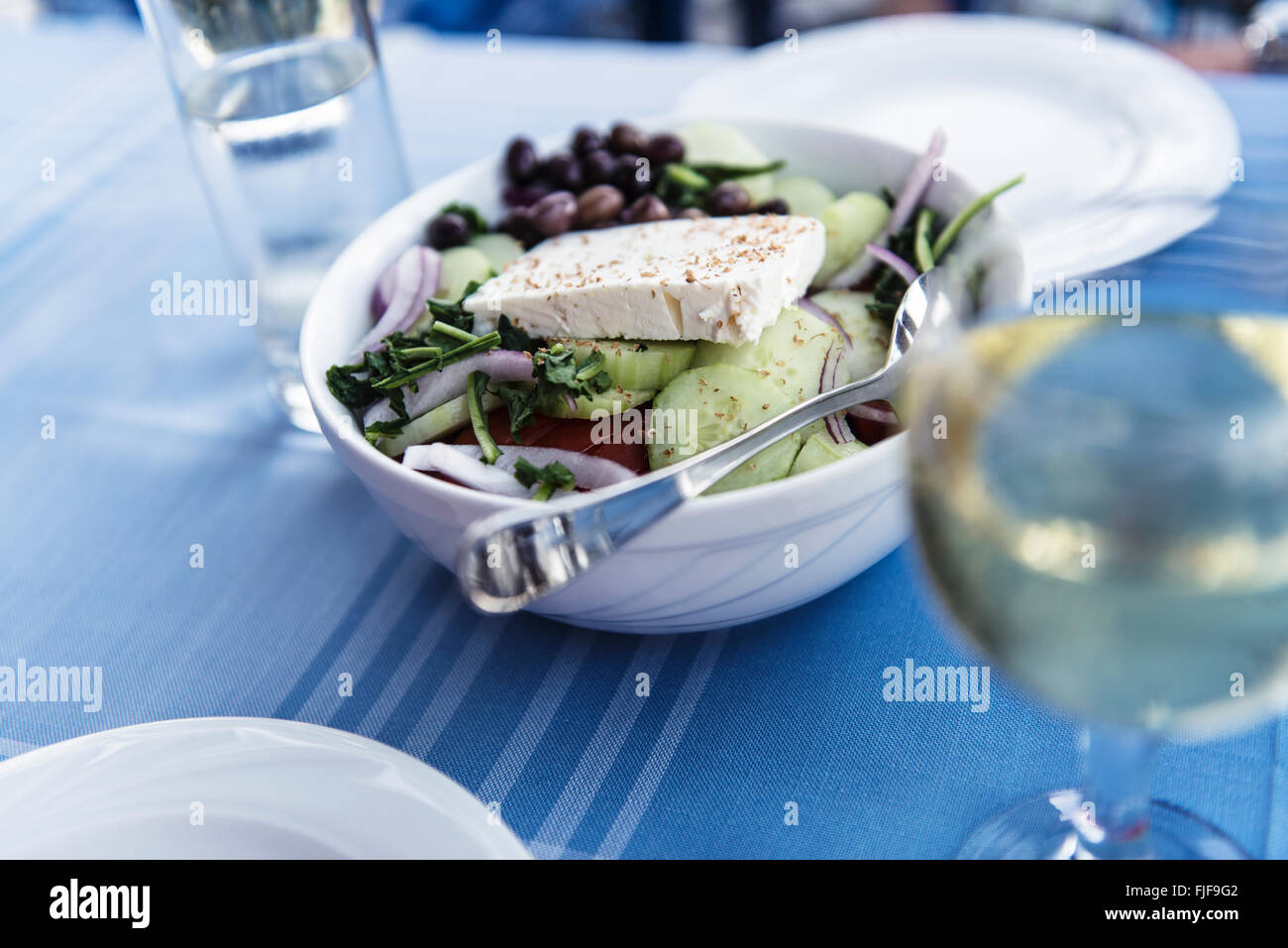 Healthy greek salat on the plate with vegetables and feta cheese, Greece Stock Photo