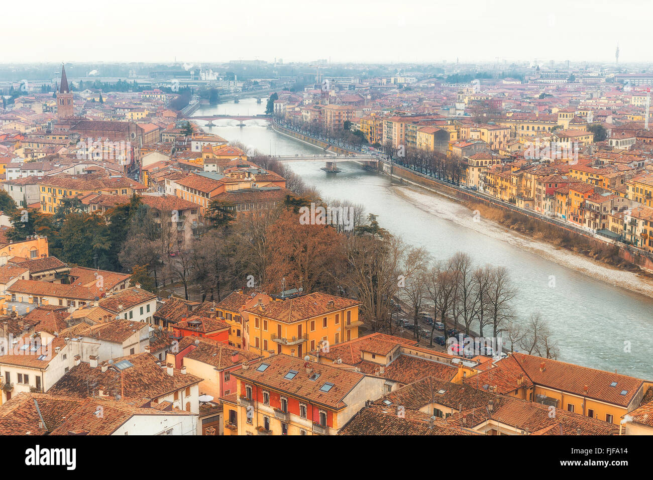 panorama of the Adige River as it passes through the houses and ...