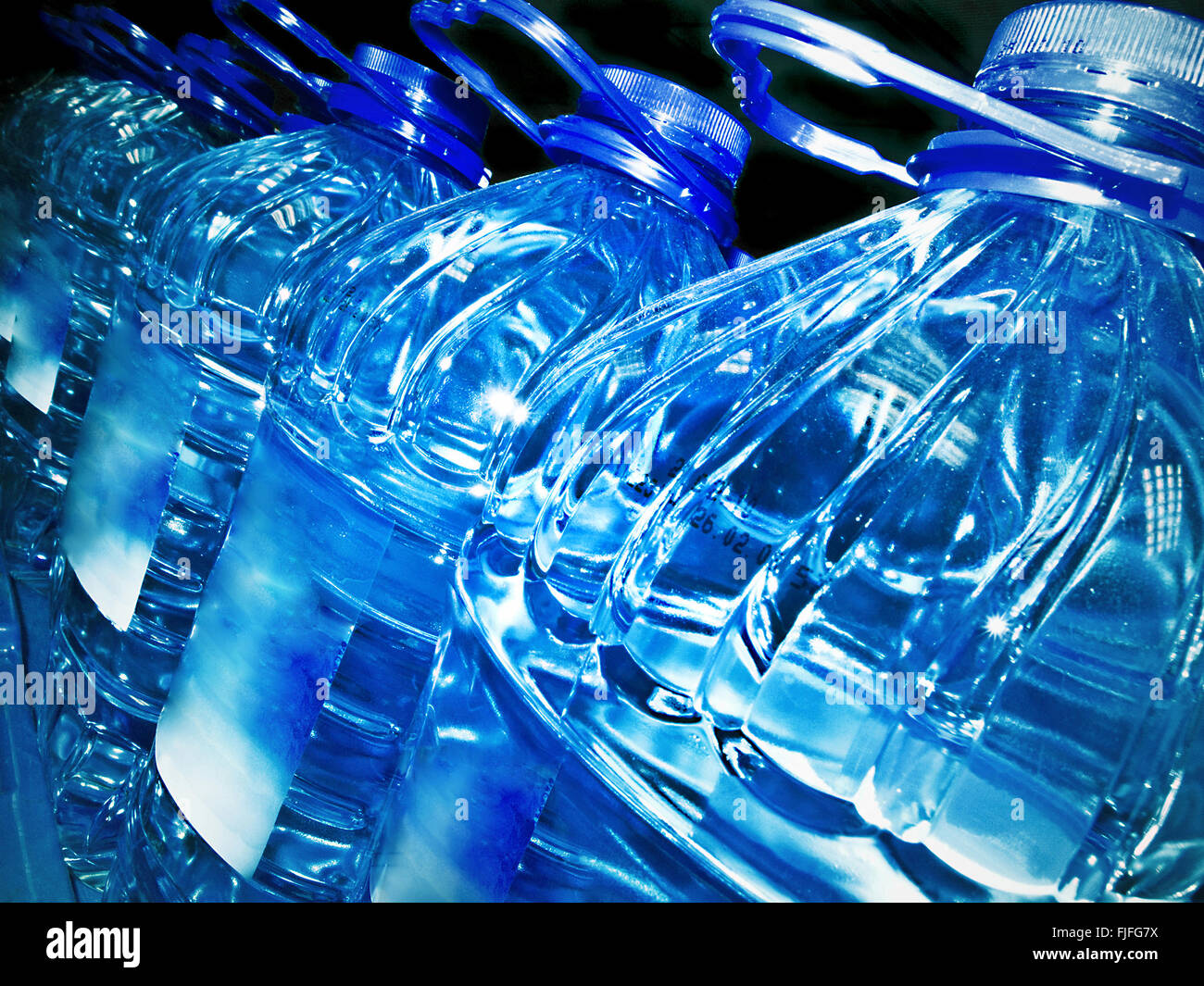 row of the bottled water in dark Stock Photo