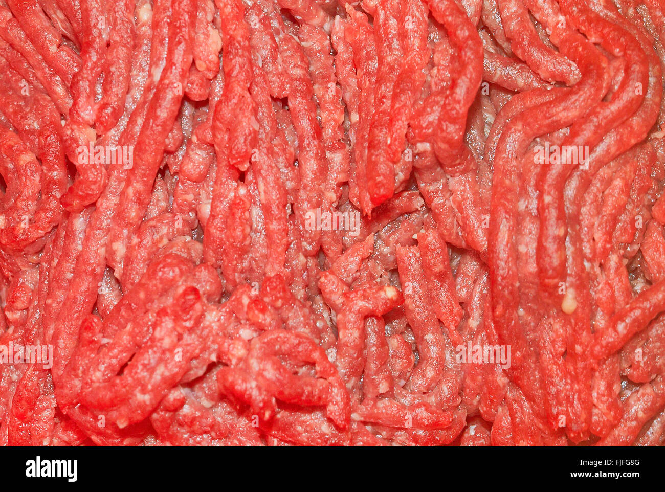 Detail of the grinding spike extruder still dirty and full of the meat it  has just ground Stock Photo - Alamy