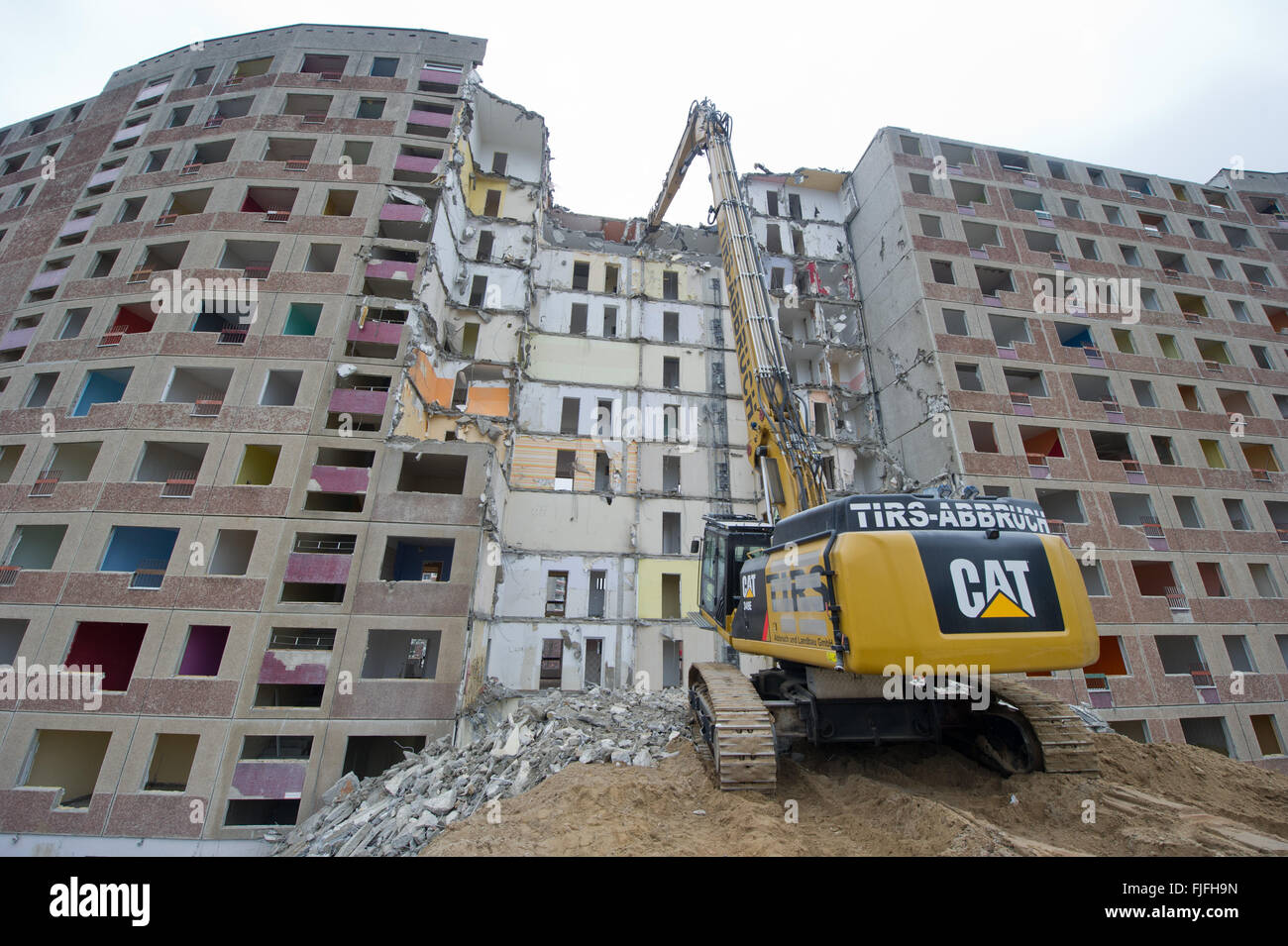 An excavator from a demolition company razes a Plattenbau building from the  German Democratic Republic at Juri Gagarin Ring 10 through 16 in  Neubrandenburg, Germany, 02 March 2016. The eleven-story apartment house