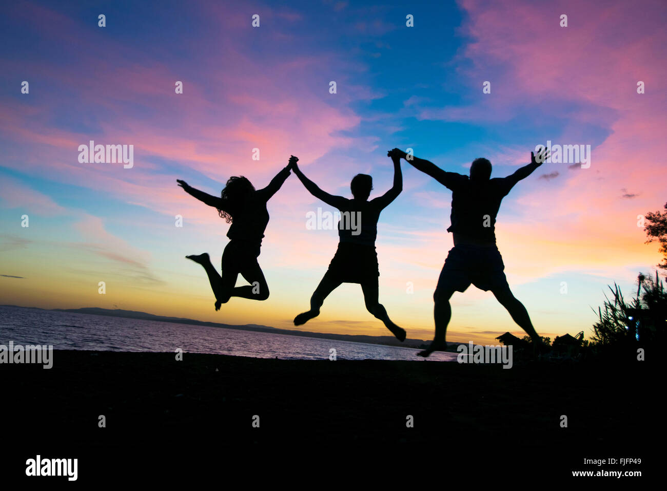 Happy family on holiday in Spain, Malaga during sunset. Making a
