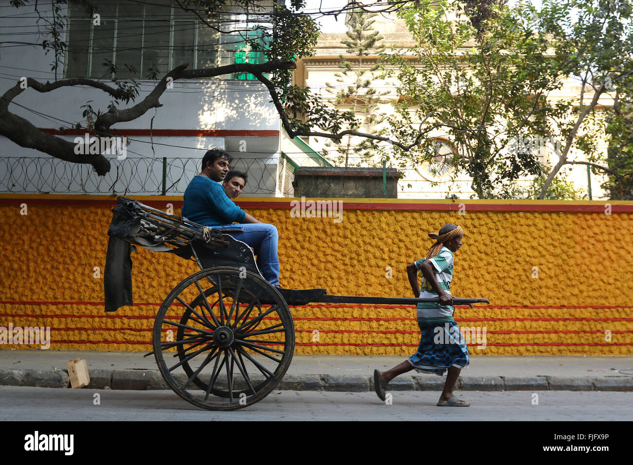 Hand pulling rickshaw puller pulling hires stock photography and images Alamy