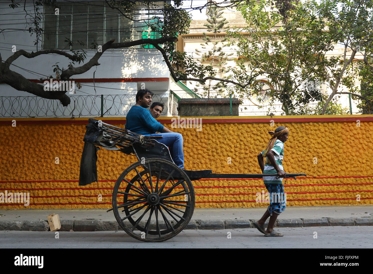 Indian man pulling rickshaw passenger hires stock photography and images Alamy