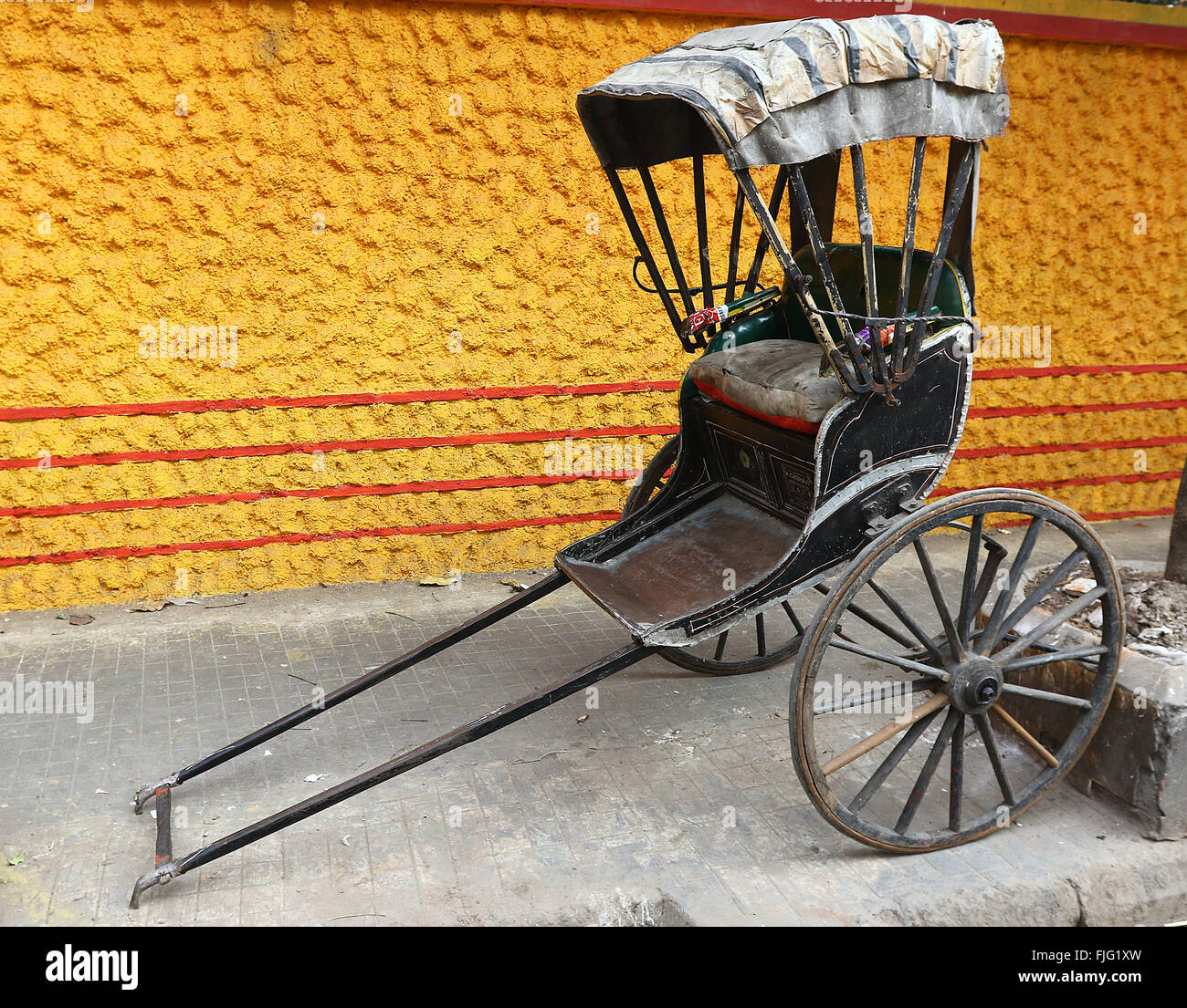 India, 20 February 2016. A hand-pulled rickshaw stands Kolkata. Photo by Palash Khan Stock Photo