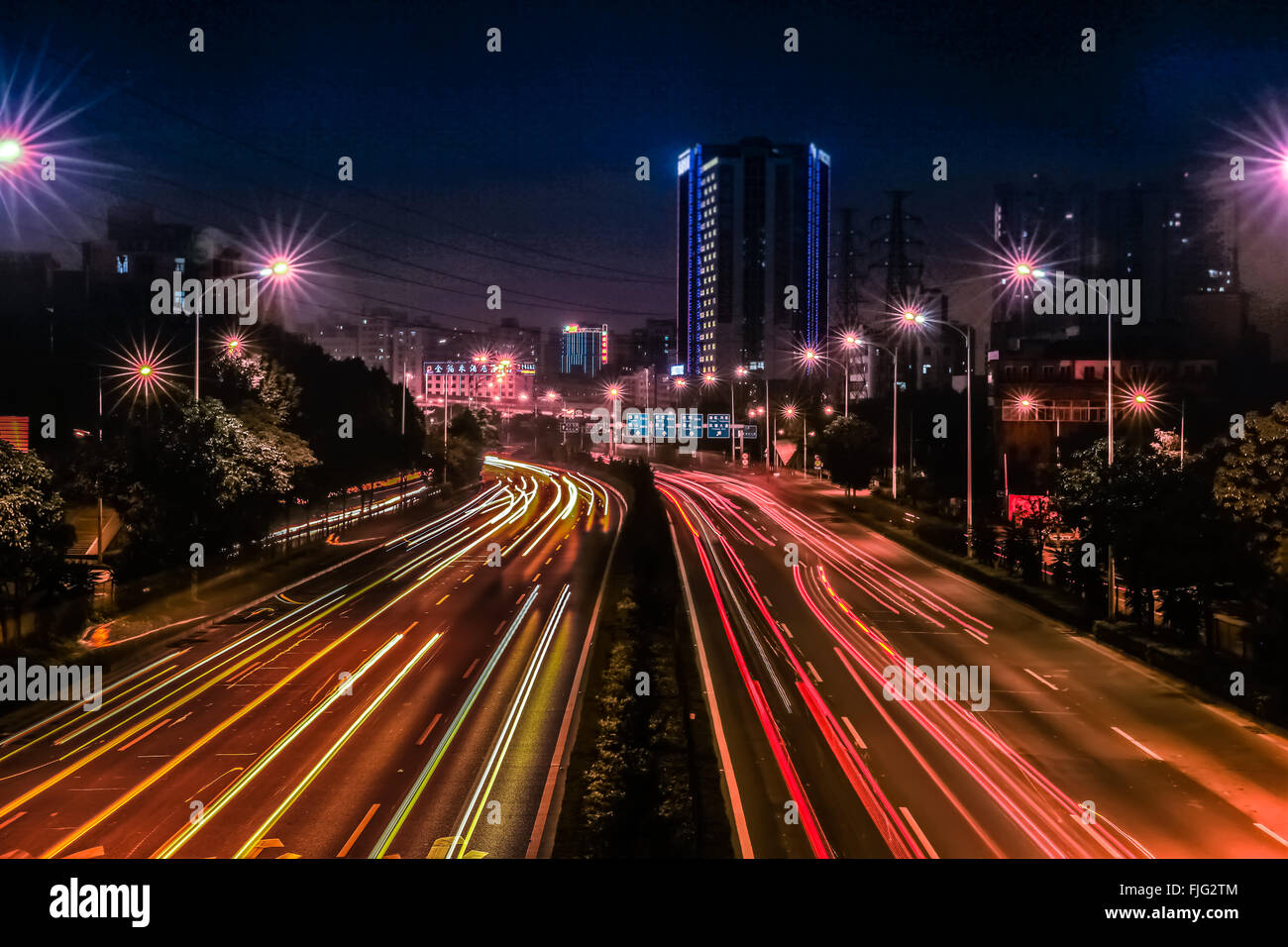 Beautiful Car light tracks taking in the Boan highway. The high volume of car light make the street very beautiful. Stock Photo