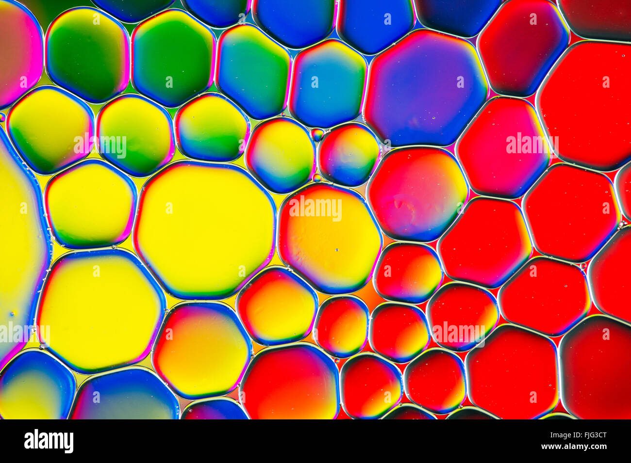 Oil on water with colourful background Stock Photo