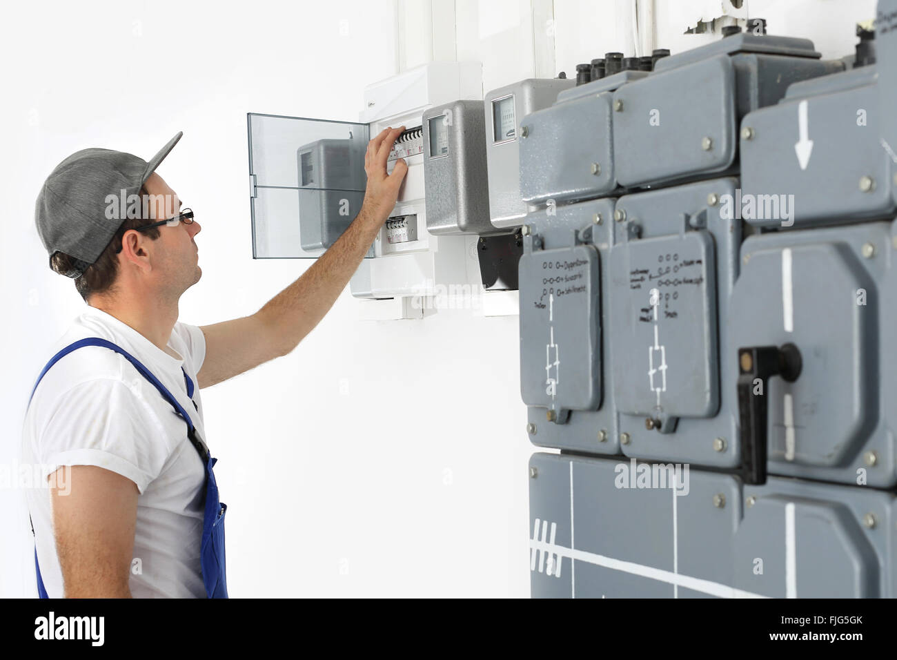Electrician. Switching current home. Corks, electrical switches on the
